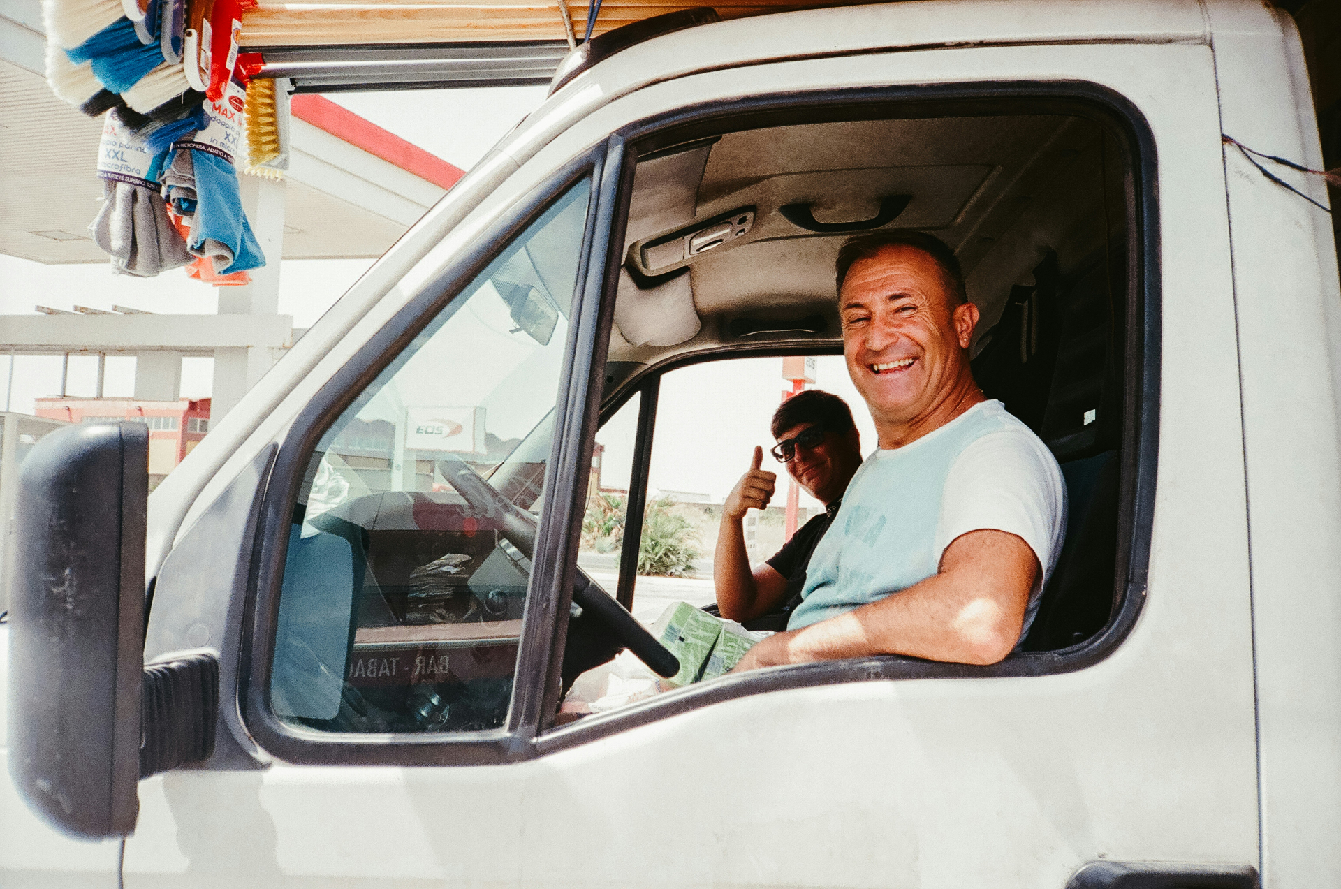 Smiling truck driver in cab